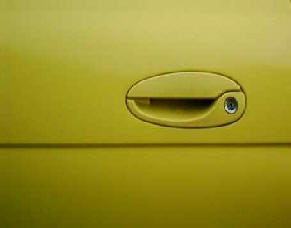 Handle of Ford car door resembling a duck's face