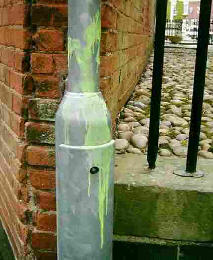 Paint splashed down a lamp post