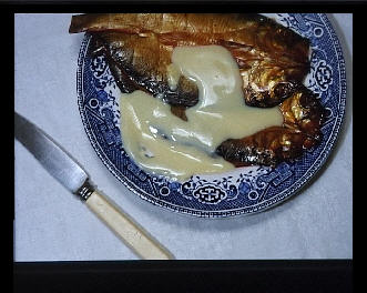 Plate with a kipper covered in custard