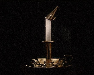 Old brass candle stick with the snuffer at an angle on the candle